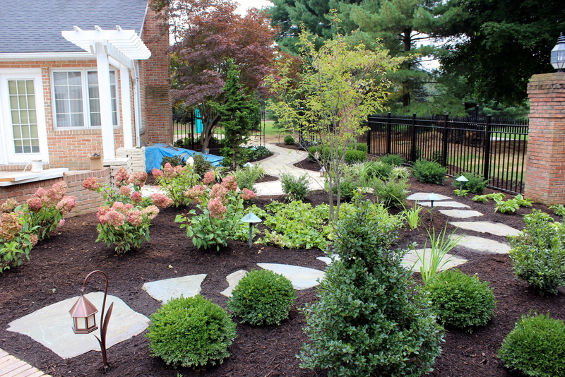 aluminum gate stone pathway landscape