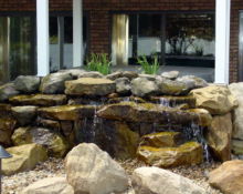 backyard waterfall installation lucas landscaping