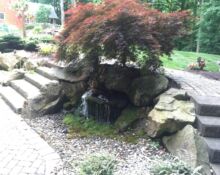 backyard waterfall installation lucas landscaping