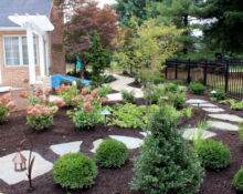 aluminum gate stone pathway landscape