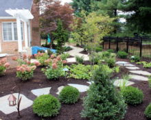 aluminum gate stone pathway landscape