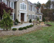 rock bed front yard trees landscaping job
