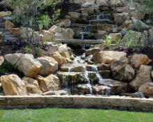 backyard waterfall installation lucas landscaping
