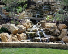 backyard waterfall installation lucas landscaping