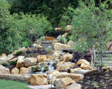 backyard waterfall installation lucas landscaping