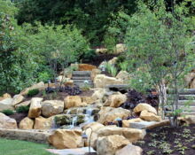 backyard waterfall installation lucas landscaping