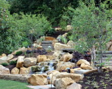 backyard waterfall installation lucas landscaping